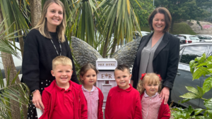 Children and teachers from Thrybergh Fullerton School in front of the Letters to Heaven post box they fundraised for.